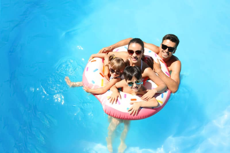 Family of four in pool